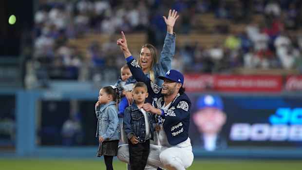Sep 22, 2023; Los Angeles, California, USA; Los Angeles Dodgers relief pitcher Joe Kelly (17) poses with wife Ashley Kelly (Ashley Parks) and children, sons Knox Kelly and Kai Kelly and twins Crue Kelly and Blake Kelly, at Dodger Stadium. Mandatory Credit: Kirby Lee-USA TODAY Sports